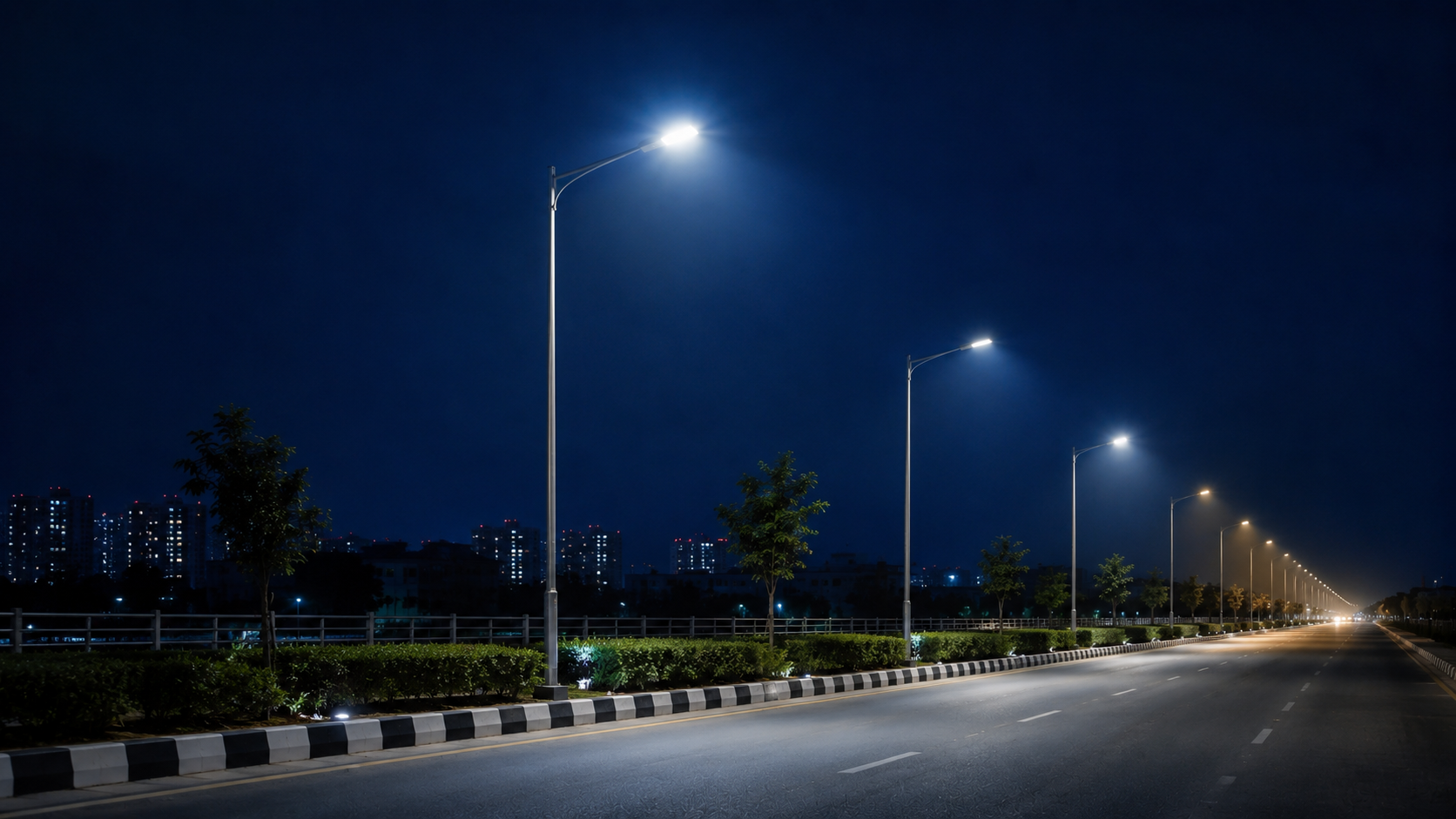 Connected street lights adapting brightness along a city road at night – adaptive lighting